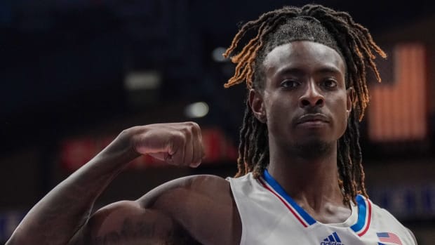 Jan 30, 2024; Lawrence, Kansas, USA; Kansas Jayhawks guard Jamari McDowell (11) celebrates against the Oklahoma State Cowboys after a score during the second half at Allen Fieldhouse. Mandatory Credit: Denny Medley-USA TODAY Sports  